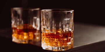 Crystal glasses filled with whiskey